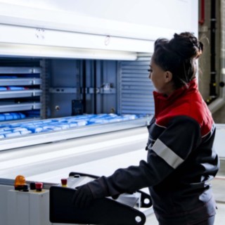 A service technician from Linde MH operates the automated small-parts warehouse.