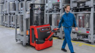 Pallet truck from Linde transporting goods. Pallet truck from Linde transporting goods.