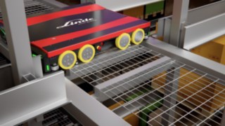 The shuttles of the S-MATIC cube can easily pass under the pallets and can thus move quickly in the storage area. A shuttle on a channel