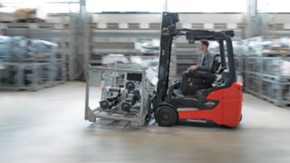 A group of people analysing the working environment in a logistics hall.
